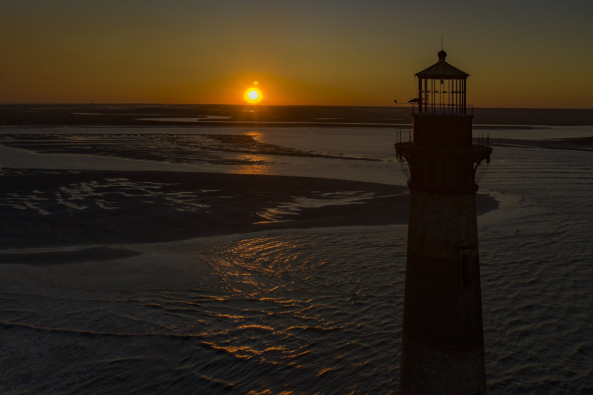 Morris Island Lighthouse at sunset near Folly Beach, Charleston SC — 1322 Customs web design